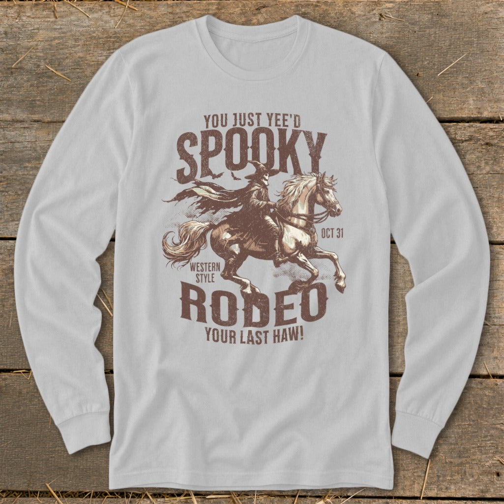 Graphic t-shirt with cowboy riding a horse, text reads "Spooky Rodeo".