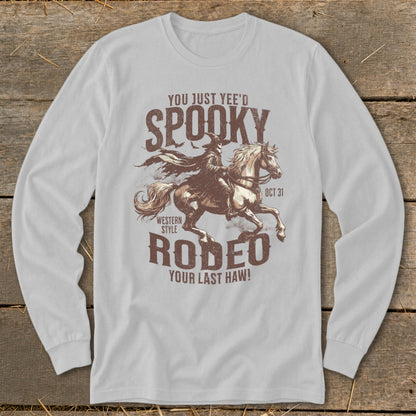 Graphic t-shirt with cowboy riding a horse, text reads "Spooky Rodeo".