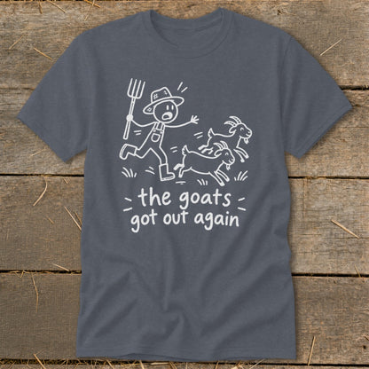 Dark gray t-shirt with cartoon of farmer chasing goats and text "the goats got out again".