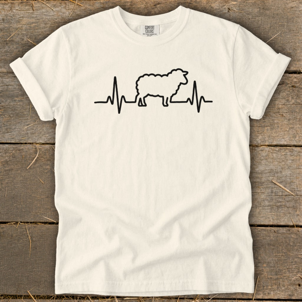 Off-white t-shirt with a black graphic of a sheep integrated into a heartbeat line.