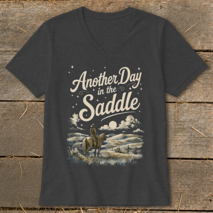 Dark gray v-neck t-shirt with "Another Day in the Saddle" text and cowboy on horseback art.