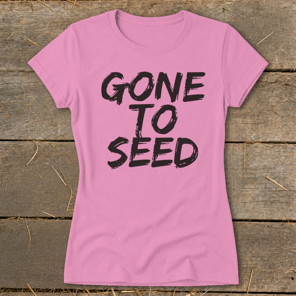 Pink t-shirt with black text that reads "GONE TO SEED".