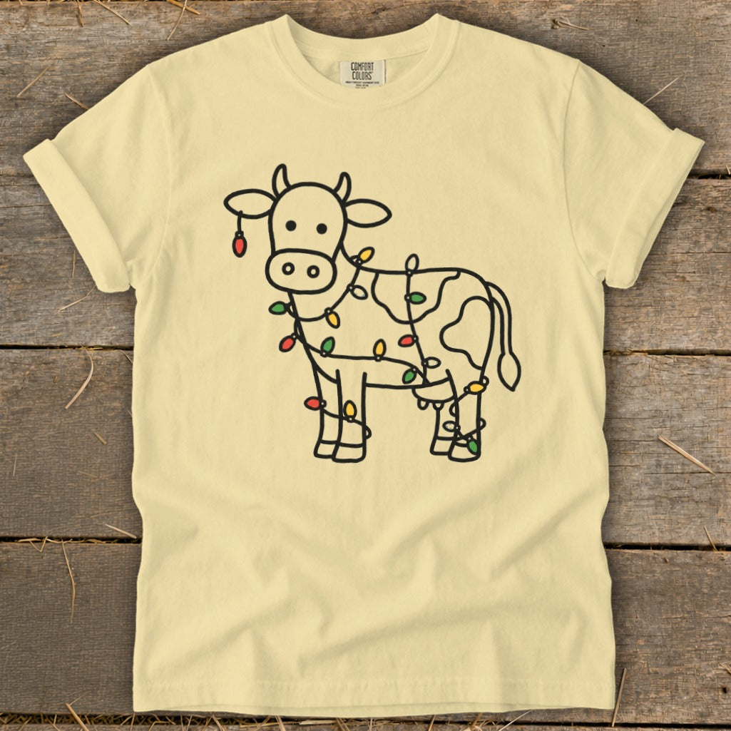 Yellow t-shirt with a cow outline decorated with colorful Christmas lights.