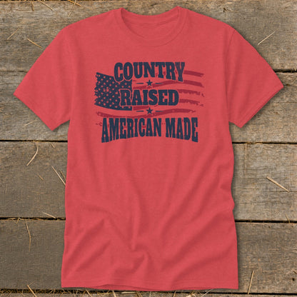 Red t-shirt with "Country Raised American Made" and distressed American flag design.