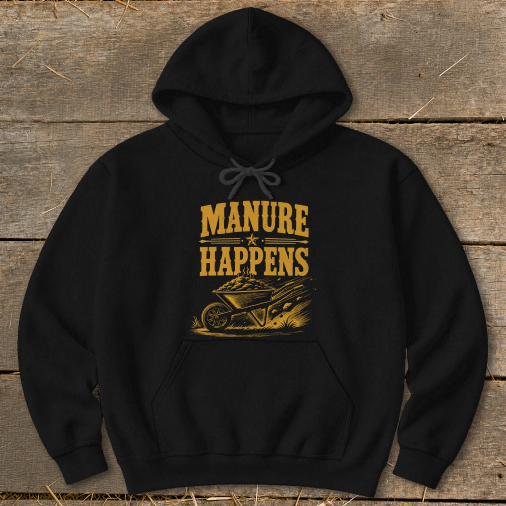 Black hoodie with "Manure Happens" text and a wheelbarrow graphic.