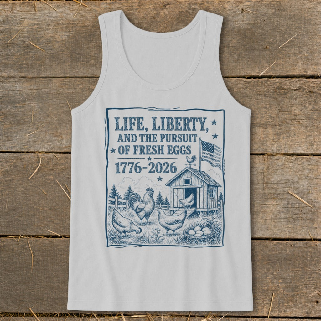White tank top with "Life, Liberty, and the Pursuit of Fresh Eggs 1776-2026" graphic.