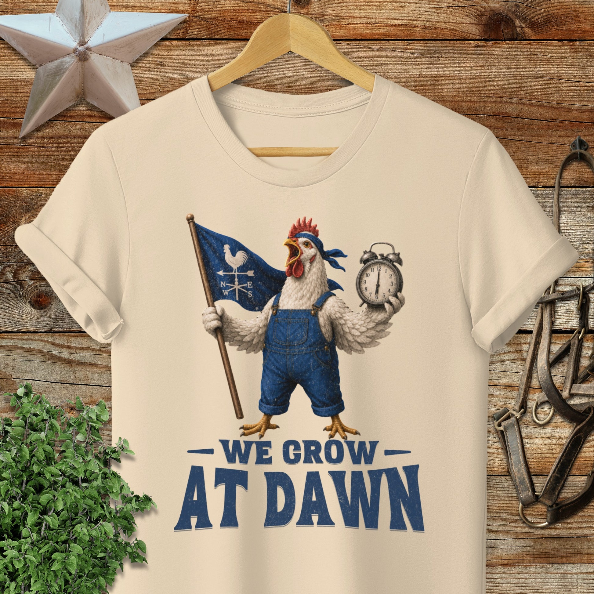 Chicken in overalls holding a flag and clock, text "WE GROW AT DAWN".
