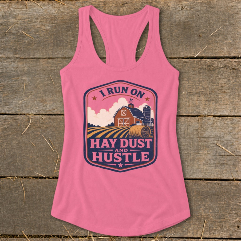 Pink tank top with farm scene and text "I run on hay dust and hustle".