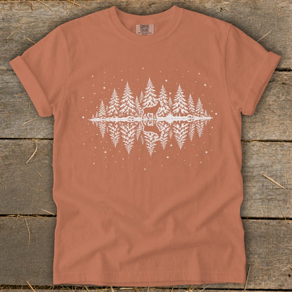 Orange t-shirt with white graphic of a deer and trees reflected in water