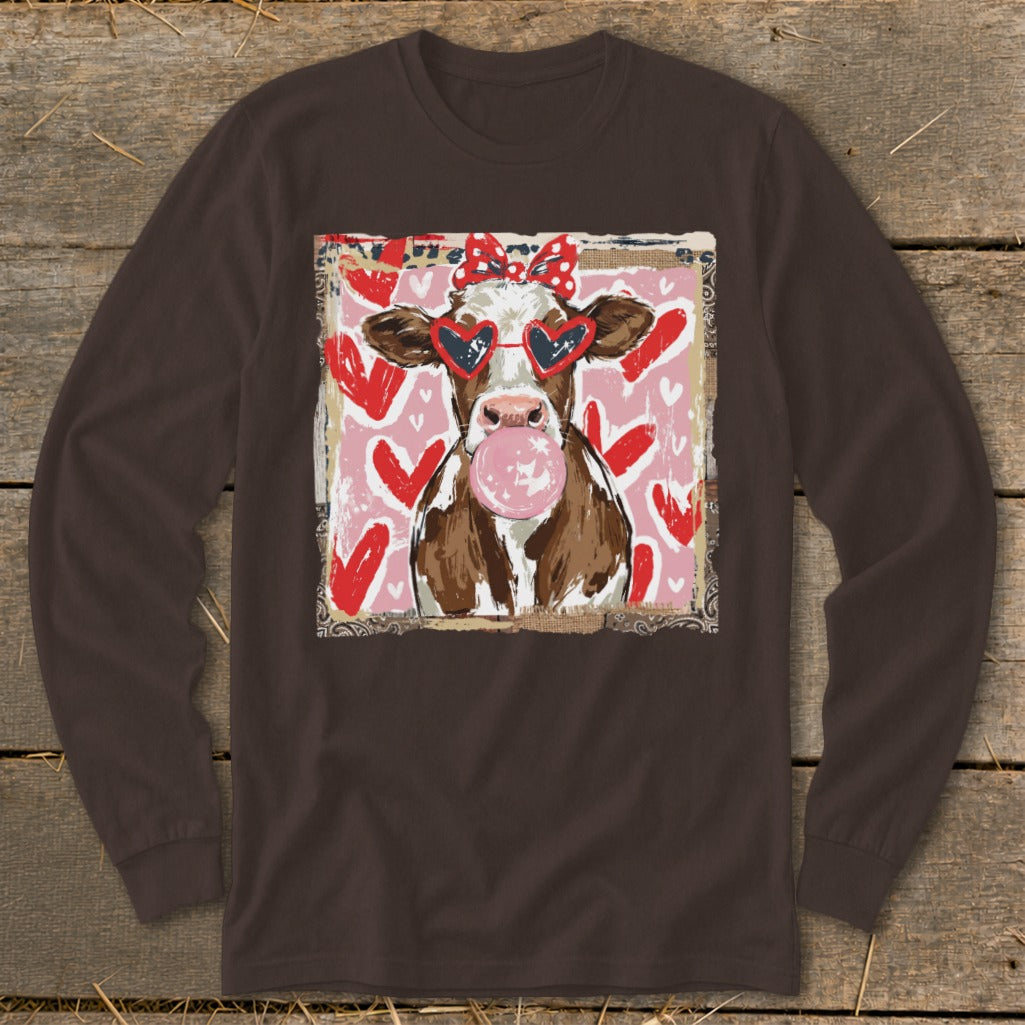 Cow wearing heart sunglasses and red bow blowing bubblegum on a pink background with hearts.