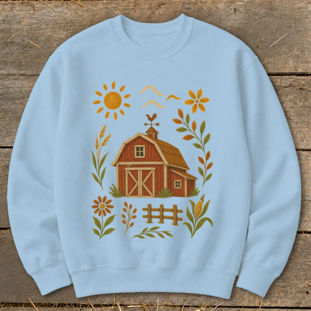 Light blue sweatshirt with a farm graphic including a barn, sun, and autumn foliage.