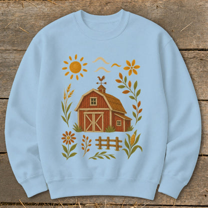 Light blue sweatshirt with a farm graphic including a barn, sun, and autumn foliage.