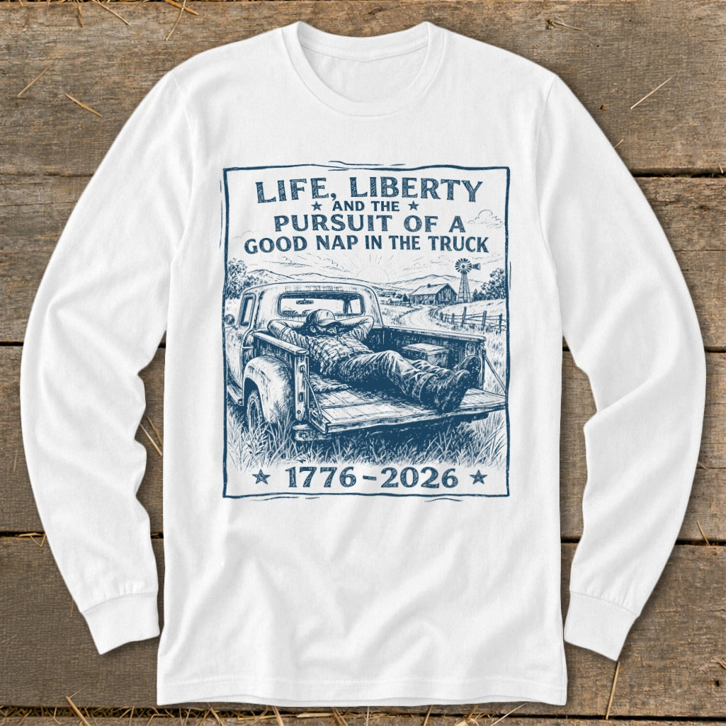 White long-sleeve shirt with "Life, Liberty and the Pursuit of a Good Nap in the Truck" graphic.