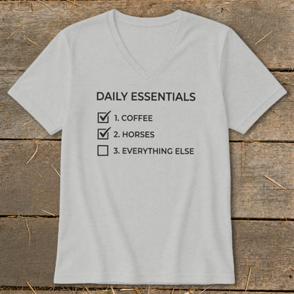 Light grey v-neck t-shirt with "Daily Essentials" list: Coffee, Horses, Everything Else.