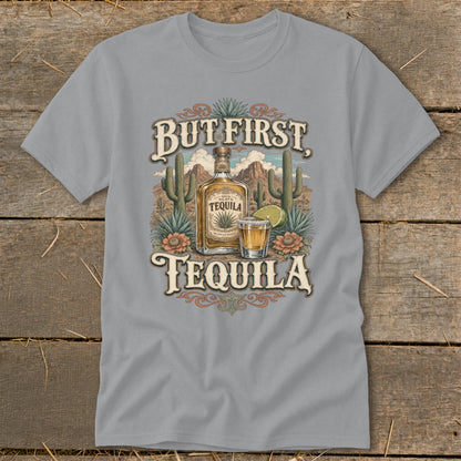 T-shirt graphic with bottle and shot of tequila, cacti, and desert landscape.