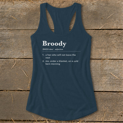 Blue tank top with "Broody" definition: a hen not leaving nest, or me under blanket.