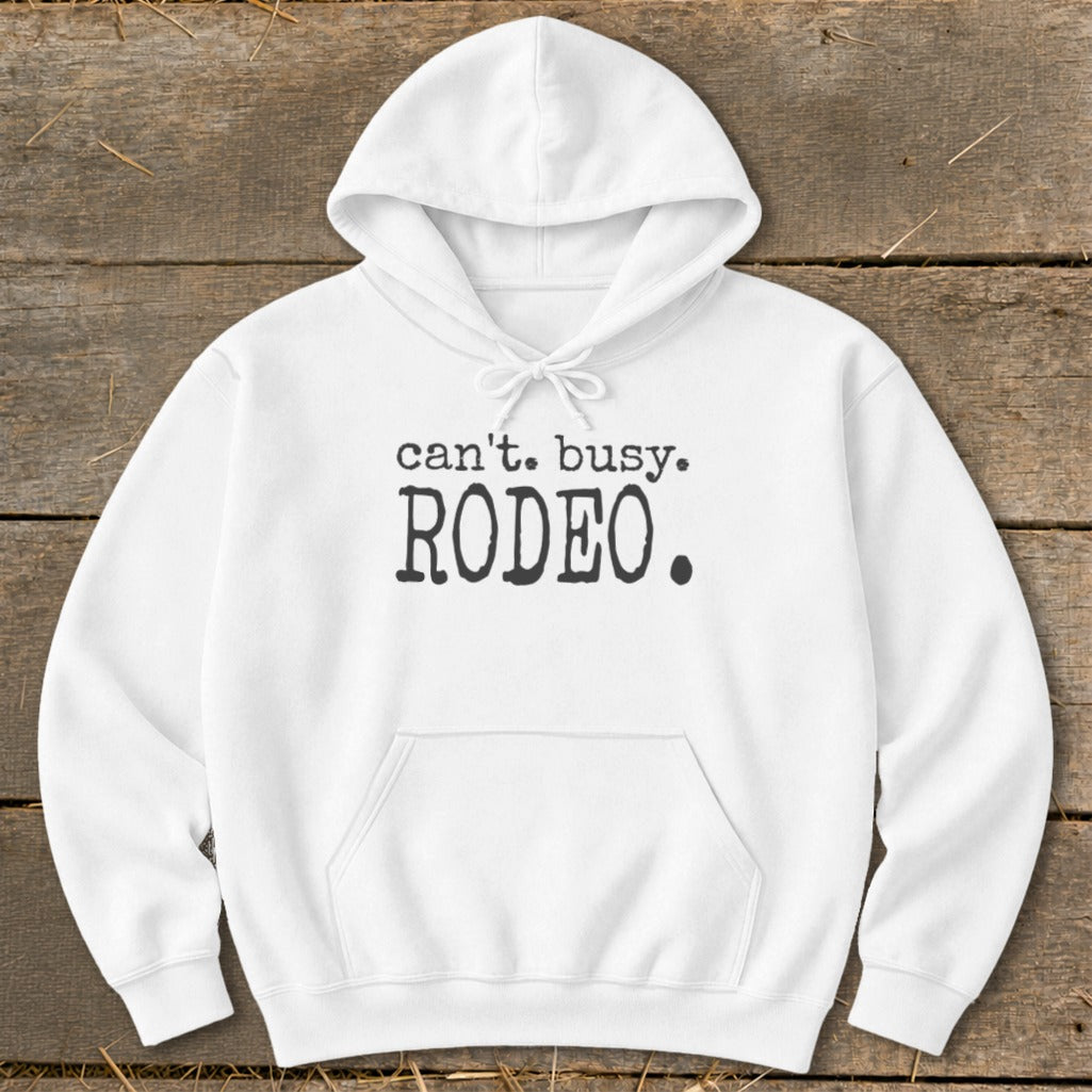 White hoodie with black text "can't. busy. RODEO."