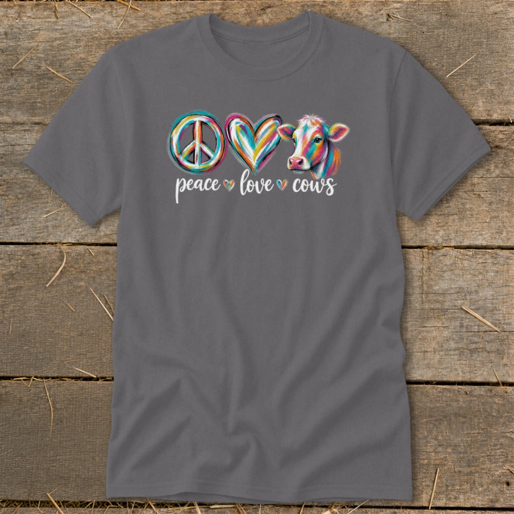 Peace love cows graphic with colorful peace sign, heart, and cow illustration.