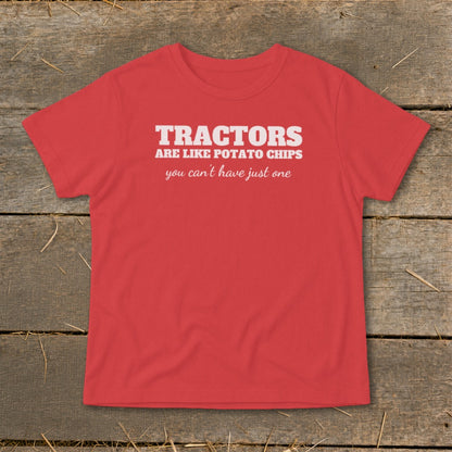 Red t-shirt with white text "Tractors are like potato chips you can't have just one."