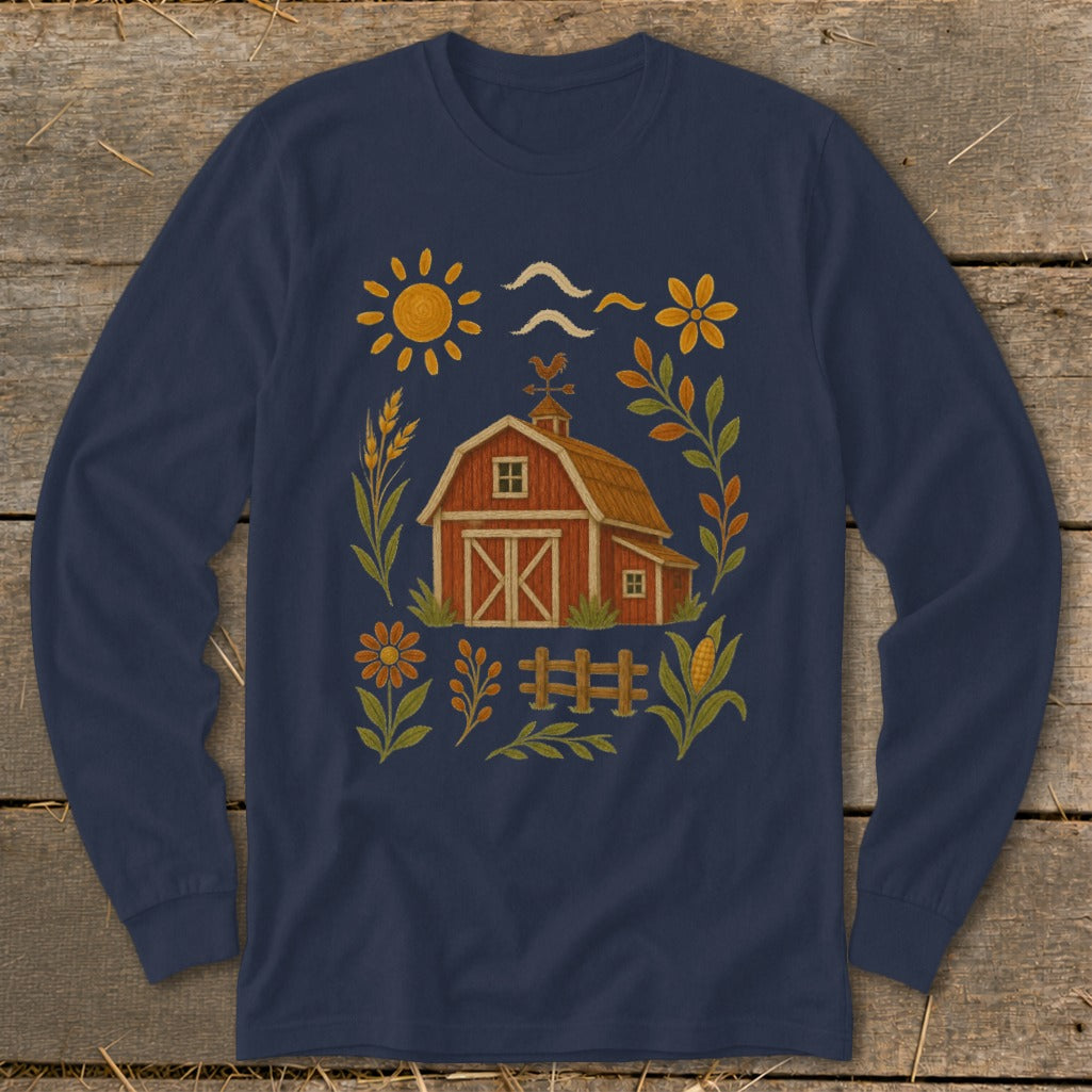 Navy long sleeve shirt with a barn, sun, and floral farm illustration.