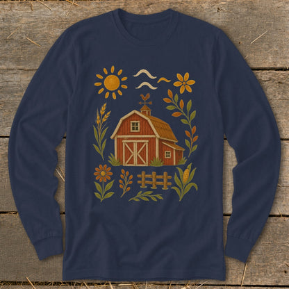 Navy long sleeve shirt with a barn, sun, and floral farm illustration.