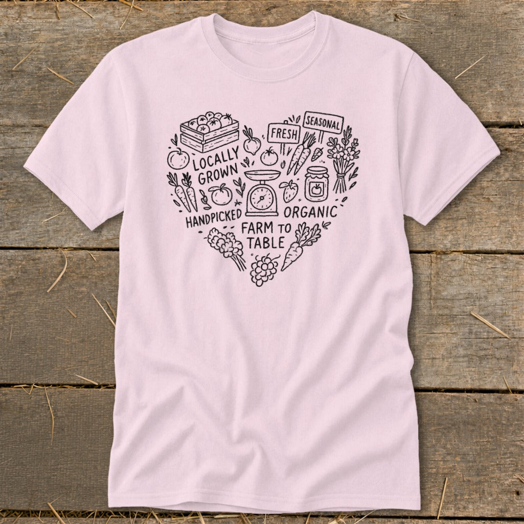 Pink t-shirt with heart design featuring farm-fresh produce and text.