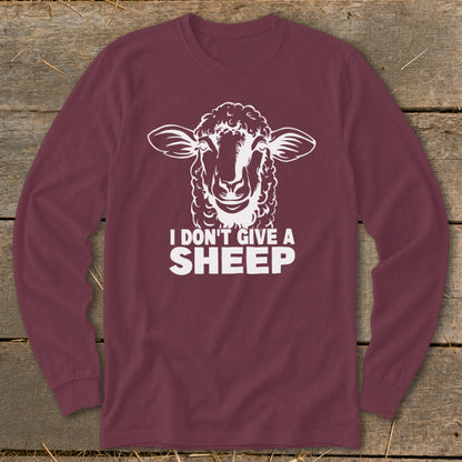 Maroon long-sleeve shirt with white graphic of a sheep and text "I DON'T GIVE A SHEEP".