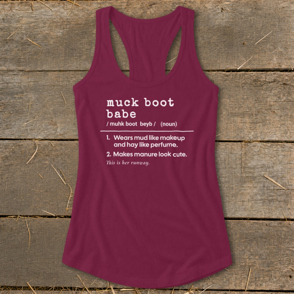Maroon tank top with white text defining "muck boot babe."