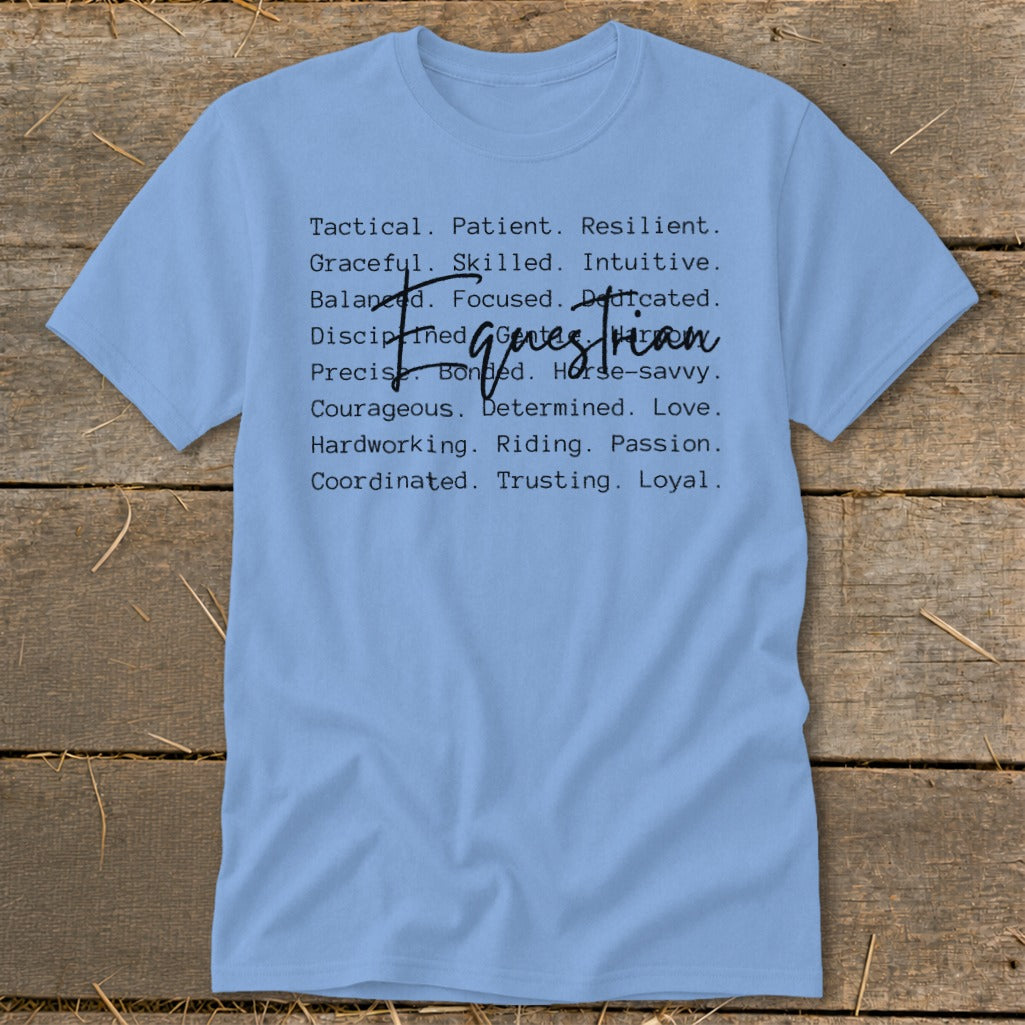 Light blue t-shirt with text listing equestrian traits like "Tactical", "Graceful", and "Riding".