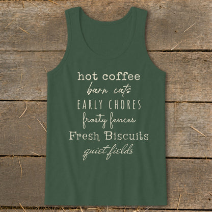 Green tank top with text: hot coffee, barn cats, EARLY CHORES, frosty fences, Fresh Biscuits, quiet fields.
