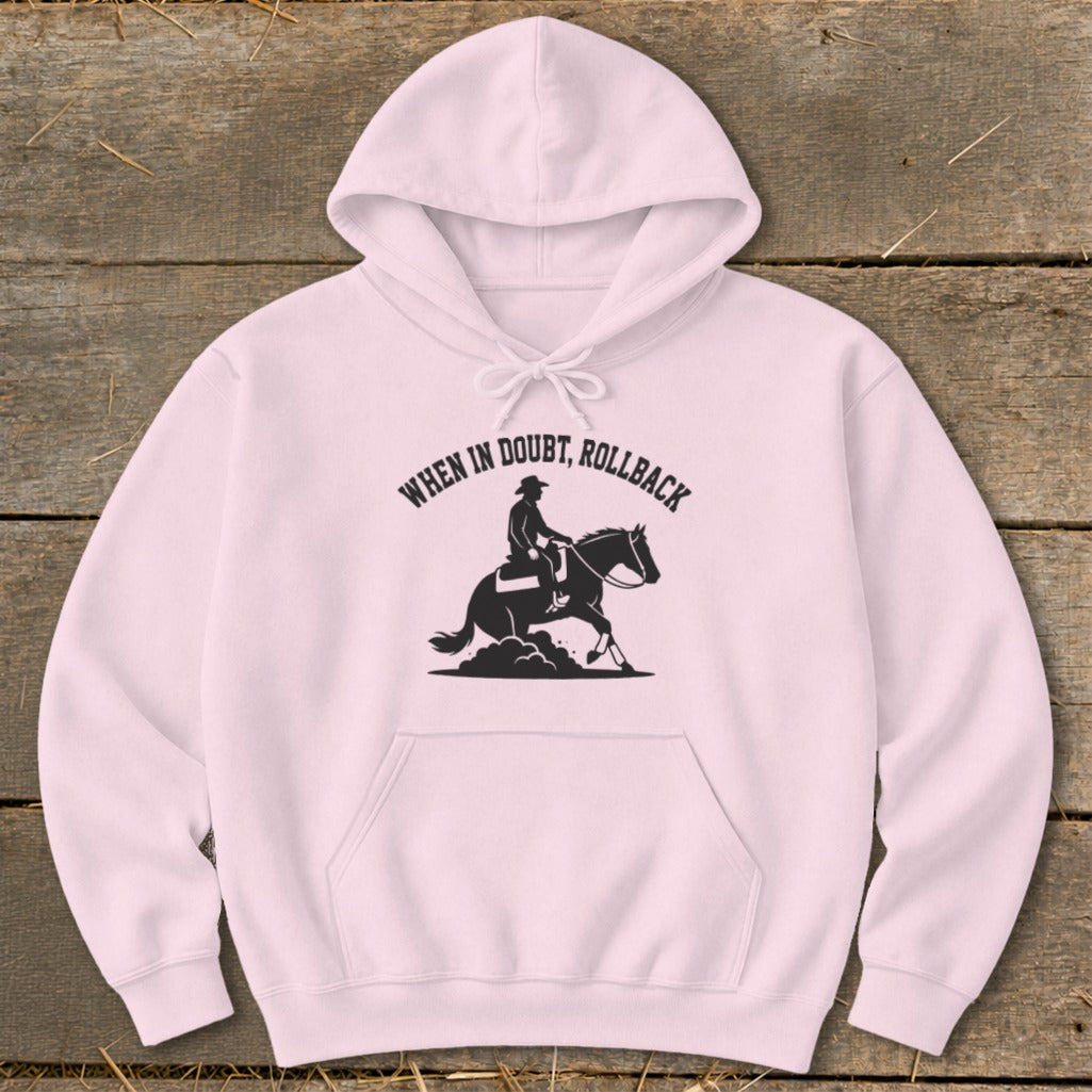 Light pink hoodie with "WHEN IN DOUBT, ROLLBACK" and horse rider graphic.