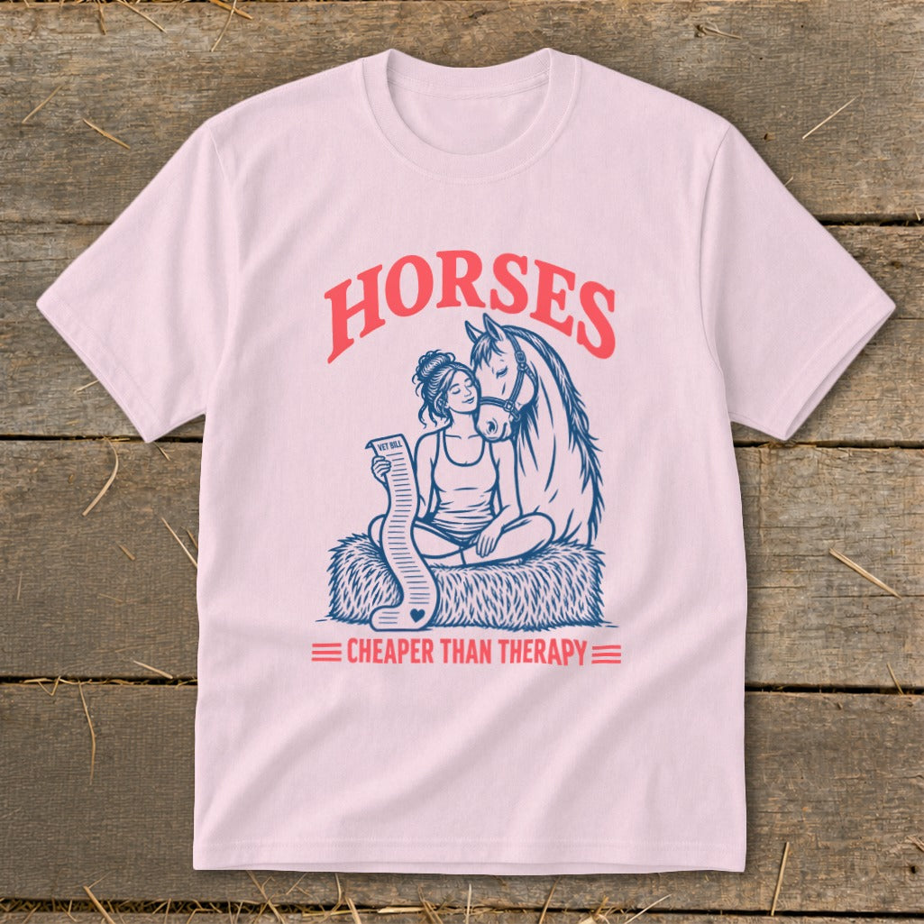 Pink t-shirt graphic with "HORSES" and "CHEAPER THAN THERAPY" text, featuring a woman and horse.