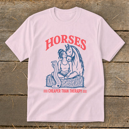 Pink t-shirt graphic with "HORSES" and "CHEAPER THAN THERAPY" text, featuring a woman and horse.