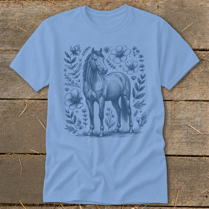 Light blue t-shirt with a blue sketch of a horse surrounded by flowers and leaves.