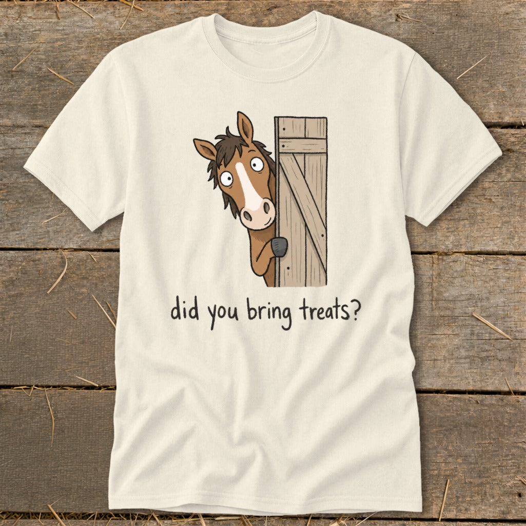 Cream t-shirt with cartoon horse peeking from wooden fence asking "did you bring treats?"