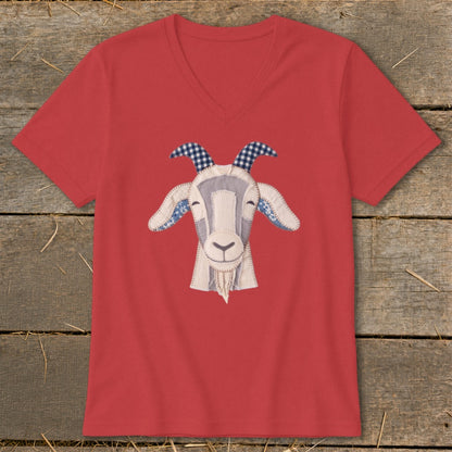 Red v-neck t-shirt with a fabric applique of a smiling goat's face.