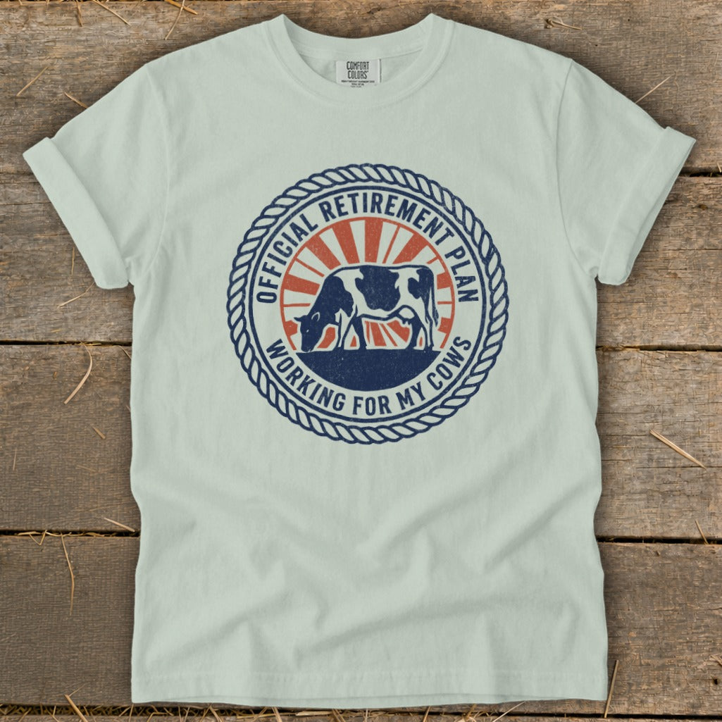 Light blue t-shirt with "Official Retirement Plan Working for My Cows" graphic.