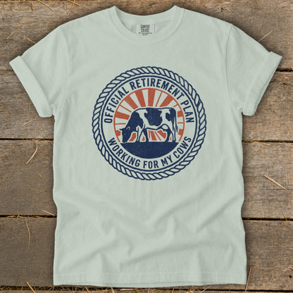 Light blue t-shirt with "Official Retirement Plan Working for My Cows" graphic.
