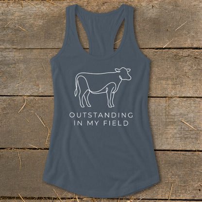 Grey tank top with a white line drawing of a cow and text reading "OUTSTANDING IN MY FIELD".