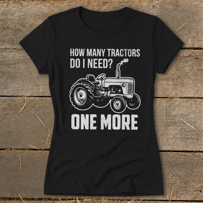 Black t-shirt with white text and tractor graphic: "How Many Tractors Do I Need? One More."