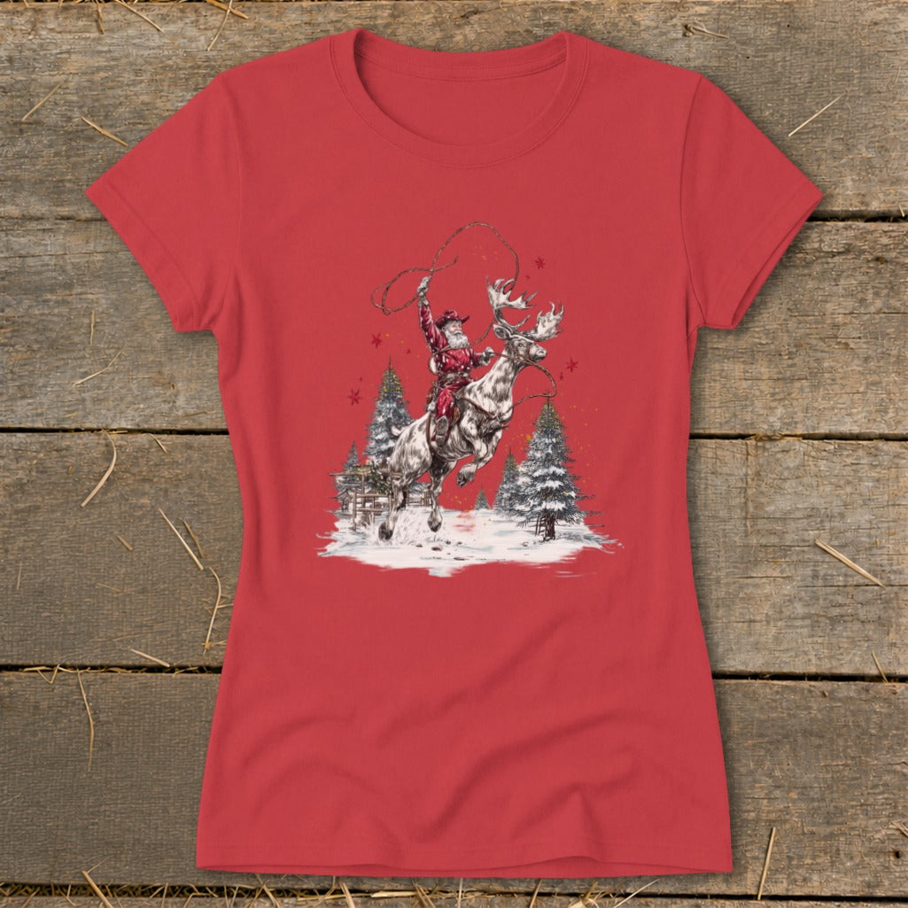 Santa riding a reindeer with a lasso, surrounded by snow and pine trees.