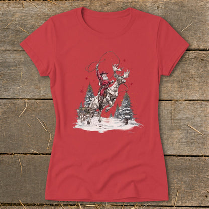 Santa riding a reindeer with a lasso, surrounded by snow and pine trees.