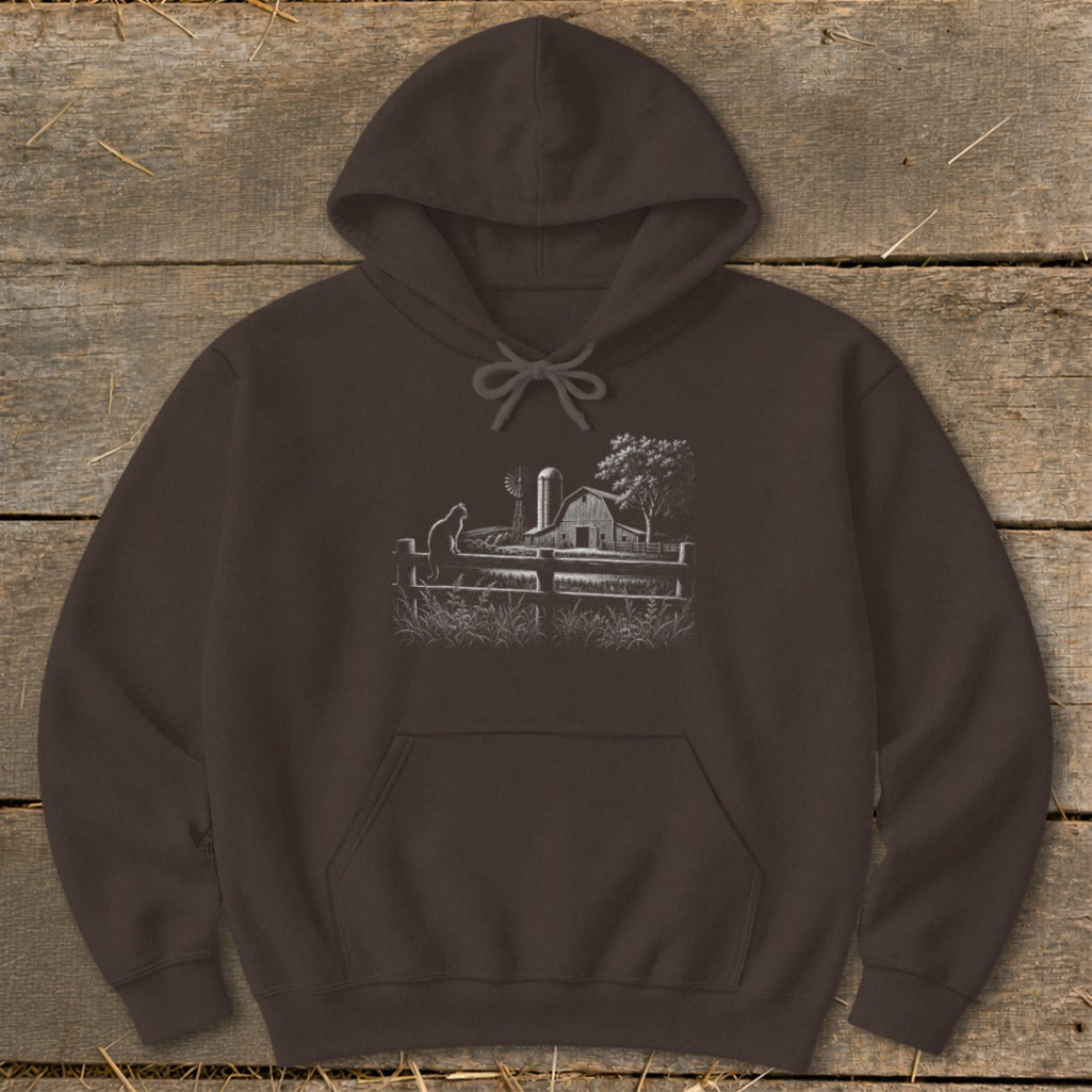 Brown hoodie with a white sketch of a barn, windmill, and cat on a fence.