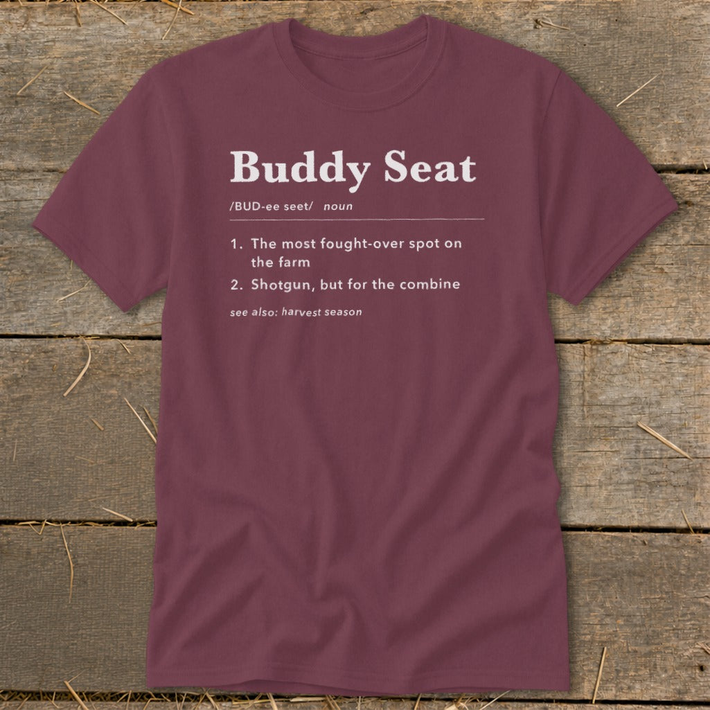 Maroon t-shirt with white text defining "Buddy Seat" for farm combine.