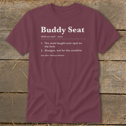 Maroon t-shirt with white text defining "Buddy Seat" for farm combine.