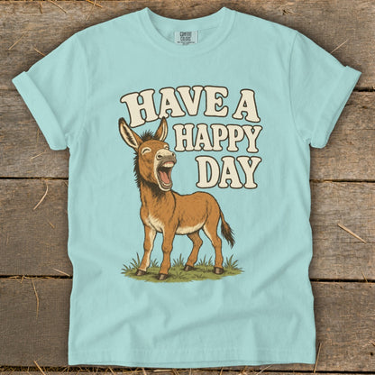 Light blue t-shirt with cartoon donkey and text "HAVE A HAPPY DAY".