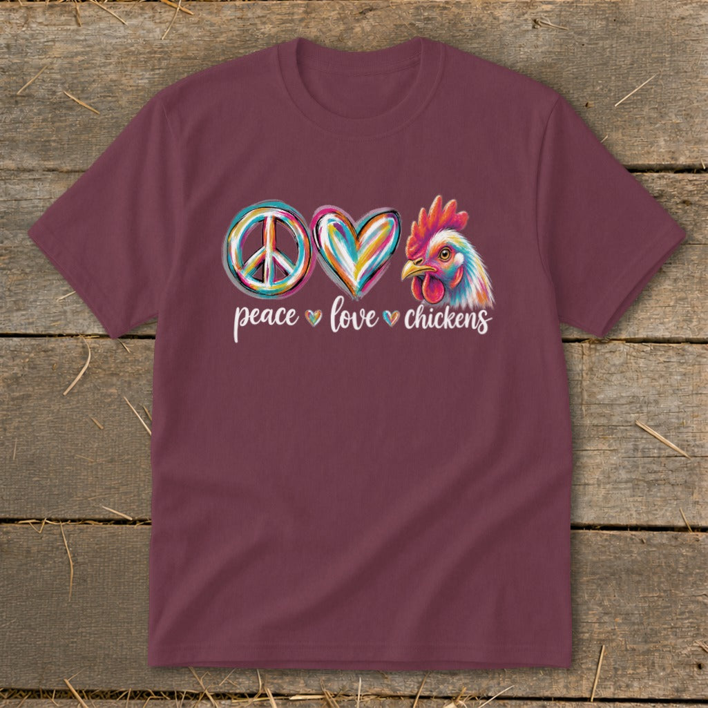 Maroon t-shirt with peace sign, heart, and colorful chicken graphic and text.