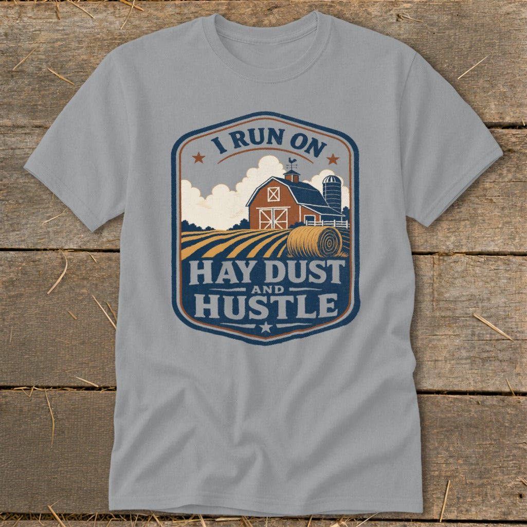 Grey t-shirt with farm scene and text "I RUN ON HAY DUST AND HUSTLE".