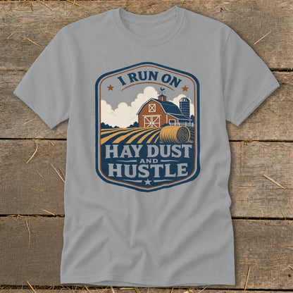 Grey t-shirt with farm scene and text "I RUN ON HAY DUST AND HUSTLE".