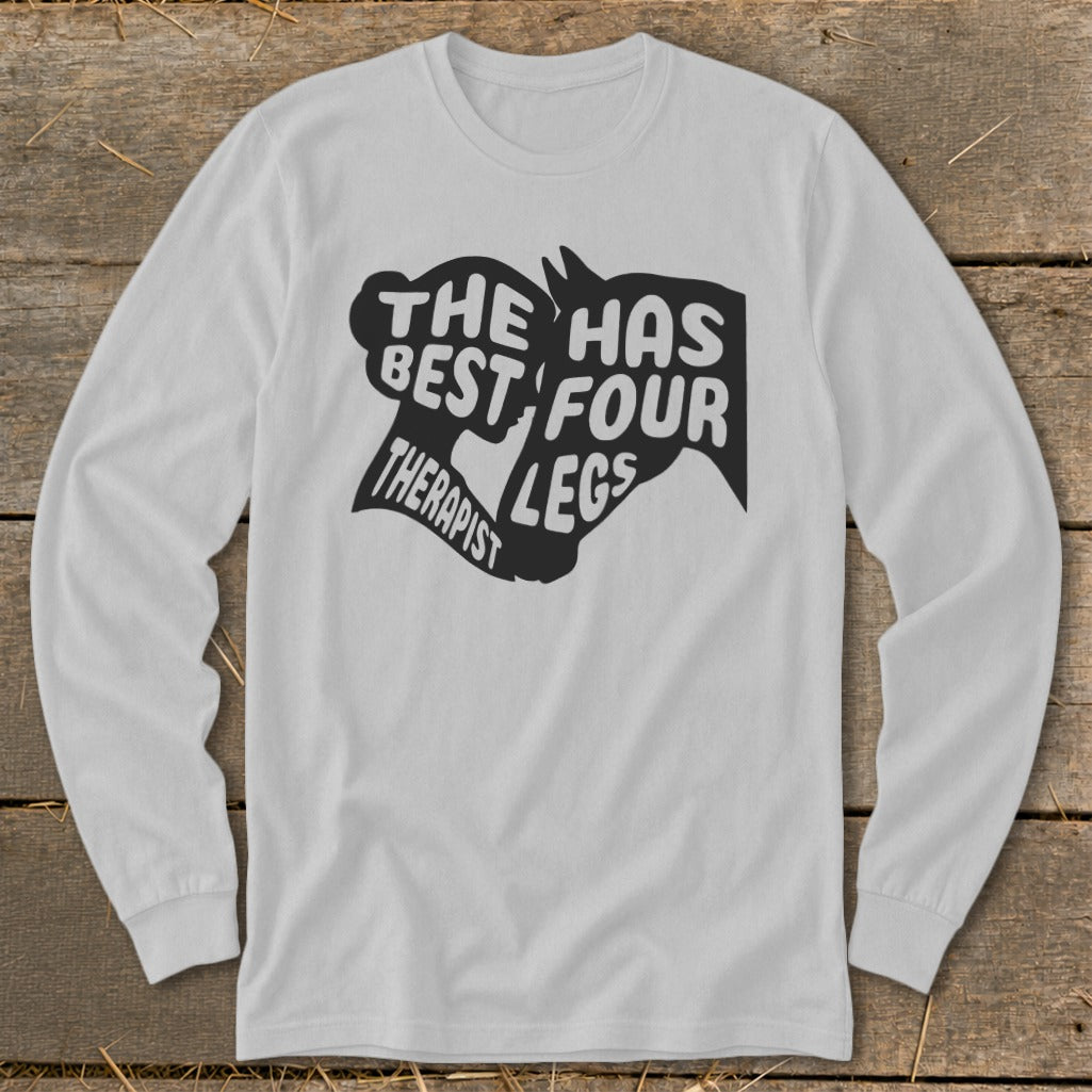 Long sleeve shirt with black graphic text: "The Best Therapist Has Four Legs".